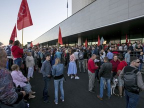 People gather for a protest rally at the Primorye region administration's building after the governor election in the Primorye region in Vladivostok, Russia's Far East, Monday, Sept. 17, 2018. Communist candidate Andrei Ishchenko,  in Russia's Far East said on Monday he is starting a hunger strike over alleged irregularities in a gubernatorial race.