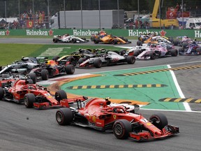 Ferrari driver Kimi Raikkonen of Finland leads at the start and followed by Ferrari driver Sebastian Vettel of Germany during the Formula One Italy Grand Prix at the Monza racetrack, in Monza, Italy, Sunday, Sept. 2, 2018.