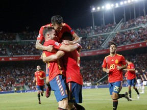 Spain's Saul Niguez, front left, celebrates with teammates after scoring his side's opening goal during the UEFA Nations League soccer match between Spain and Croatia at the Manuel Martinez Valero stadium in Elche, Spain, Tuesday Sept. 11, 2018.