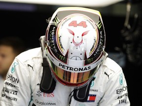 Mercedes driver Lewis Hamilton of Britain prepares in the pit garage during the third free practice at the Sochi Autodrom circuit in Sochi, Russia, Saturday, Sept. 29, 2018. The Formula One race will be held on Sunday.