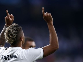 Real forward Mariano Diaz celebrates after scoring his side's third goal during a Group G Champions League soccer match between Real Madrid and Roma at the Santiago Bernabeu stadium in Madrid, Spain, Wednesday Sept. 19, 2018.