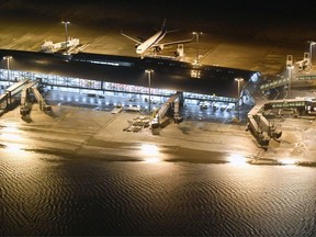 Kansai International Airport partially is flooded by typhoon Jebi in Osaka, western Japan, Tuesday, Sept. 4, 2018. A powerful typhoon blew through western Japan on Tuesday, causing heavy rain to flood the region's main offshore international airport and high winds to blow a tanker into a connecting bridge, disrupting land and air travel.