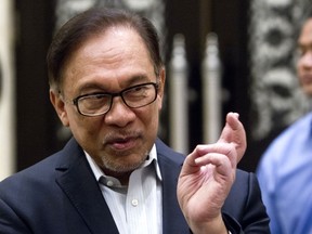 Malaysian politician Anwar Ibrahim speaks before a court hearing at Federal Court in Putrajaya, Malaysia, Friday, Sept. 14, 2018. Anwar, who is named as successor to prime minister Mahathir Mohamad, said it's time for him to make a comeback as a lawmaker to focus on parliamentary reforms.