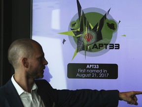 Alister Shepherd, the director of a subsidiary of the cybersecurity firm FireEye, gestures during a presentation about the APT33 hacking group, which his firm suspects are Iranian government-aligned hackers, in Dubai, United Arab Emirates, Tuesday, Sept. 18, 2018. FireEye warned Tuesday that Iranian government-aligned hackers have stepped up their efforts in the wake of President Donald Trump pulling America from the nuclear deal.