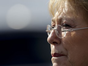 FILE - In this July 20, 2017, file photo, Chile's then President Michelle Bachelet looks on during a visit to Memory Park which honors the victims of the country's dictatorship, in Buenos Aires, Argentina. Bachelet was 23 years old when she was tortured and fled her country's dictatorship into exile. Now in 2018, more than four decades later, she will have to face her painful past as the new U.N. human rights chief fighting such abuses worldwide.