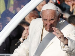 Pope Francis greets people as he arrives for a Mass at Santakos Park, in Kaunas, Lithuania, Sunday, Sept. 23, 2018. Francis is paying tribute to Lithuanians who suffered and died during Soviet and Nazi occupations on the day the country remembers the near-extermination of its centuries-old Jewish community during the Holocaust.