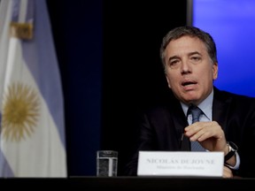 Argentina's Treasury Minister Nicolas Dujovne gives a news conference in Buenos Aires, Argentina Monday, Sept. 3, 2018.