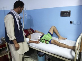 An injured man receives treatment at a hospital following a deadly attack in Kabul, Afghanistan, Wednesday, Sept. 5, 2018. Twin bombings at a wrestling training center in a Shiite neighborhood of Afghanistan's capital on Wednesday killed at least 20 people and wounded others, Afghan officials said.