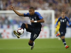 France's Kylian Mbappe controls the ball during the UEFA Nations League soccer match between France and The Netherlands at the Stade de France stadium in Saint-Denis, outside Paris, France, Sunday, Sept. 9, 2018.