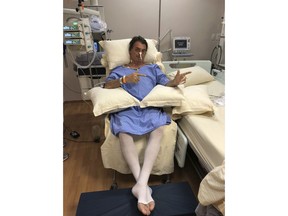 In this handout photo provided by the National Social Liberal Party press office, presidential candidate Jair Bolsonaro poses for a photo while sitting in his hospital room at the Albert Einstein Hospital, in Sao Paulo, Brazil, Saturday, Aug. 8, 2018. The far-right congressman was stabbed on Thursday during a campaign rally. Bolsonaro, 63, suffered intestinal damage and serious internal bleeding, according to Dr. Luiz Henrique Borsato, one of the surgeons who operated on the candidate.