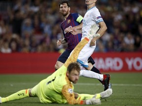 Barcelona forward Lionel Messi scores his side's fourth goal during the group B Champions League soccer match between FC Barcelona and PSV Eindhoven at the Camp Nou stadium in Barcelona, Spain, Tuesday, Sept. 18, 2018.