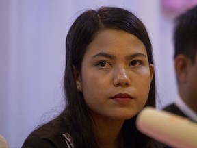 Chit Su Win, wife of Reuters journalist Kyaw Soe Oo, listens to questions during a press briefing at a hotel Tuesday, Sept. 4, 2018, in Yangon, Myanmar. A Myanmar court sentenced two Reuters journalists to seven years in prison Monday on charges of illegal possession of official documents, a ruling met with international condemnation that will add to outrage over the military's human rights abuses against Rohingya Muslims.