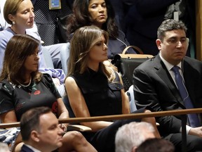 Melania Trump, center, wife of President Donald Trump, watches his address to the 73rd session of the United Nations General Assembly, at U.N. headquarters, Tuesday, Sept. 25, 2018.