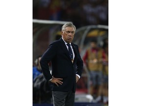 Napoli coach Carlo Ancelotti watches his team during the Champions League group C soccer match between Red Star and Napoli, in Belgrade, Serbia, Tuesday, Sept. 18, 2018.