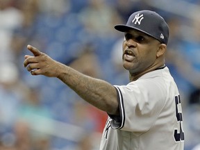 New York Yankees' CC Sabathia points at the Tampa Bay Rays dugout after he was ejected for hitting Tampa Bay Rays' Jesus Sucre with a pitch during the sixth inning of a baseball game Thursday, Sept. 27, 2018, in St. Petersburg, Fla.