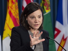 Alberta Environment Minister Shannon Phillips speaks with the media during a news conference in Ottawa, Wednesday October 24, 2018.
