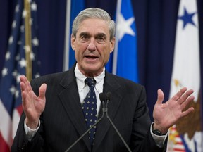 In this file photo taken on August 1, 2013, then-Federal Bureau of Investigation (FBI) Director Robert Mueller speaks during a farewell ceremony in Mueller's honour at the Department of Justice.