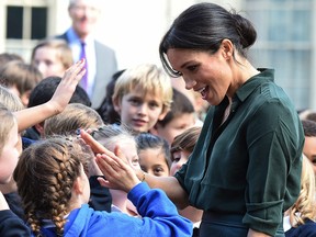 Meghan, Duchess of Sussex greets local school children in Brighton during an official visit to Sussex on October 3, 2018 in Brighton, United Kingdom.
