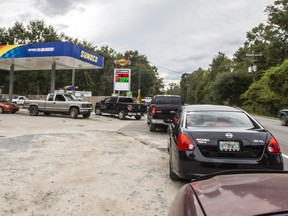People line up for gasoline as Hurricane Michael bears down on the northern Gulf coast of Florida on October 8, 2018 outside Tallahassee, Florida.