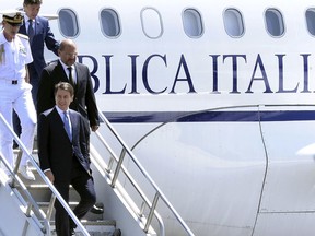Italy's Prime Minister Giuseppe Conte, foreground, arrives at the airport in Addis Ababa, Ethiopia Thursday, Oct. 11, 2018 for a bilateral visit to the country. The two parties will have bilateral discussions on trade, investment, and other matters according to Ethiopia's Prime Minister's office.