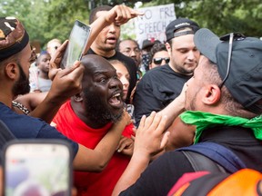 Antifa and counter protestors to a far-right rally argue during the Unite the Right 2 Rally in Washington, D.C., on August 12, 2018.