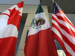 The Canadian, Mexican, and U.S. flags...