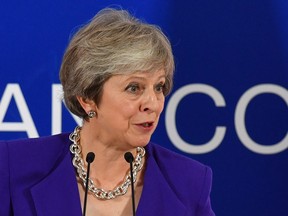 Britain's Prime minister Theresa May addresses a press conference on the sidelines of a EU summit at the European Council in Brussels on October 18, 2018.