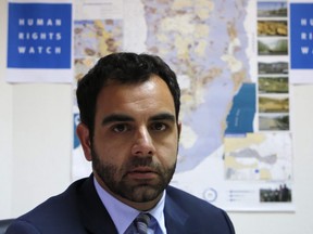 In this file photo taken on May 09, 2018 Human Rights Watch's Israel and Palestine director Omar Shakir sits at his office in the West Bank city of Ramallah. The Palestinian security forces "systematically" abuse and torture prisoners in what could amount to crimes against humanity, Human Rights Watch said.