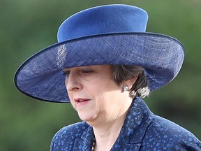 Britain's Prime Minister Theresa May arrives to attend a ceremonial welcome for King Willem-Alexander and Queen Maxima of the Netherlands on Horse Guards Parade in London on October 23, 2018, at the start of the Dutch King and Queen's two-day state visit.