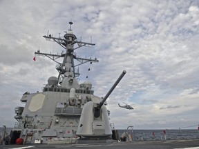 This US navy photo obtained October 21, 2016 shows an MH-60R Sea Hawk assigned to Helicopter Maritime Strike Squadron 49 as it takes off from the flight deck aboard the destroyer USS Decatur on September 14, 2016 in the Sea of Japan.