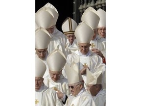 Pope Francis, top center, arrives for a canonization ceremony in St. Peter's Square at the Vatican, Sunday, Oct. 14, 2018. Pope Francis canonizes two of the most important and contested figures of the 20th-century Catholic Church, declaring Pope Paul VI and the martyred Salvadoran Archbishop Oscar Romero as models of saintliness for the faithful today.