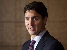 Canadian Prime Minister Justin Trudeau comments on the government's Trans Mountain Pipeline plan as he makes his way to caucus on Parliarment Hill in Ottawa, Wednesday, October 3, 2018.