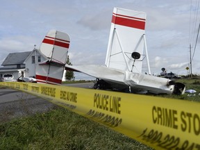 Police tape marks the scene after a small plane crashed near Carp, Ont., Tuesday, Oct.16, 2018.
