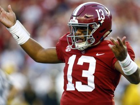 Alabama quarterback Tua Tagovailoa (13) gestures after throwing a touchdown pass during the first half against Missouri in an NCAA college football game Saturday, Oct. 13, 2018, in Tuscaloosa, Ala.