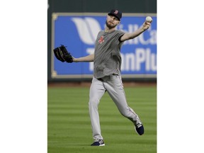 Boston Red Sox starting pitcher Chris Sale warms up during batting practice before Game 4 of a baseball American League Championship Series against the Houston Astros on Wednesday, Oct. 17, 2018, in Houston.