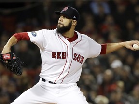 Boston Red Sox starting pitcher David Price throws against the Houston Astros during the first inning in Game 2 of a baseball American League Championship Series on Sunday, Oct. 14, 2018, in Boston.