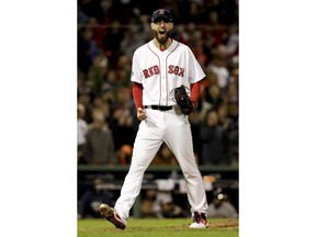Boston Red Sox pitcher Rick Porcello celebrates after the last out in the top of the eighth inning in Game 2 of a baseball American League Championship Series against the Houston Astros on Sunday, Oct. 14, 2018, in Boston.