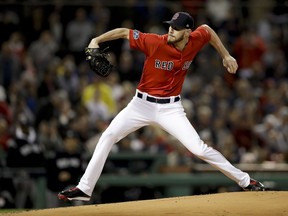 Boston Red Sox starting pitcher Chris Sale throws to a New York Yankees batter during the first inning of Game 1 of a baseball American League Division Series on Friday, Oct. 5, 2018, in Boston.