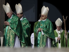 Pope Francis, bottom right, arrives to celebrate a Mass for the opening of a synod, a meeting of bishops, in St. Peter's Square, at the Vatican, Wednesday, Oct. 3, 2018. The synod is bringing together 266 bishops from five continents for talks on helping young people feel called to the church at a time when church marriages and religious vocations are plummeting in much of the West.