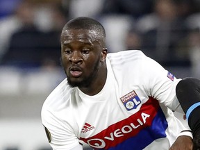 FILE - In this Thursday, Nov. 23, 2017 file photo,  Lyon's Tanguy Ndombele challenges for the ball with Apollon's Emilio Zelaya during a Europa League group E soccer match in Decines, near Lyon, central France.  It was reported on Thursday, Oct. 4, 2018 that Ndombele  has been called up to play for France for the first time and defender Mamadou Sakho was recalled for a friendly against Iceland and a UEFA Nations League match against Germany.