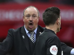 FILE - In this Saturday, Oct.6, 2018 file photo, Newcastle United's manager Rafael Benitez reacts to a decision by the referee during their English Premier League soccer match between Manchester United and Newcastle United at Old Trafford in Manchester, England. Keeping Newcastle in the Premier League for another year might be one of the greatest achievements in Benitez's coaching career. Newcastle's has made its worst nine-game start to a league campaign since 1898. It has no wins in nine games, just two points, and five straight home losses.