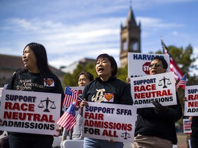 Demonstrators protest Harvard University's admissions process at a rally in Boston's Copley Square on Oct. 14, 2018. Harvard has been accused of favouring applications from African-American and Latino students at the expense of more qualified Asian-Americans.