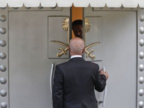 A man enters Saudi Arabia's consulate in Istanbul, Friday, Oct. 19, 2018. A Turkish official said Friday that investigators are looking into the possibility that the remains of missing Saudi journalist Jamal Khashoggi may have been taken to a forest in the outskirts of Istanbul or to another city -- if and after he was killed inside the consulate earlier this month.