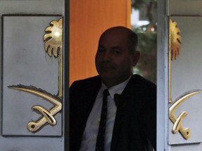 A security guard exits Saudi Arabia's consulate in Istanbul, Tuesday, Oct. 23, 2018. Saudi officials murdered Saudi writer Jamal Khashoggi in their Istanbul consulate after plotting his death for days, Turkey's President Recep Tayyip Erdogan said Tuesday, contradicting Saudi Arabia's explanation that the writer was accidentally killed. He demanded that the kingdom reveal the identities of all involved, regardless of rank.