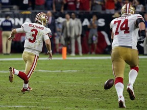 CORRECTS PLAYER TO SAN FRANCISCO 49ERS QUARTERBACK C.J. BEATHARD, INSTEAD OF ARIZONA CARDINALS QUARTERBACK JOSH ROSEN - San Francisco 49ers quarterback C.J. Beathard (3) chases down a bad snap against the Arizona Cardinals during the second half of an NFL football game, Sunday, Oct. 28, 2018, in Glendale, Ariz. The Cardinals won 18-15.