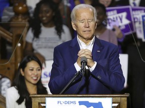 Former vice president Joe Biden takes a moment as fans cheer when a supporter shouted that Biden should run for president in 2020, during a rally for Democrats in downtown Orlando, Fla., Tuesday, Oct. 23, 2018.