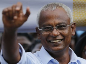 FILE - In this Monday, Sept. 24, 2018, file photo, Ibrahim Mohamed Solih, the president-elect of the Maldives interacts with his supporters during a gathering in Male, Maldives. Solih has scored another victory Wednesday by securing a majority in Parliament after the Elections Commission restored 12 lawmakers who were earlier deemed to have lost their seats.