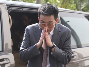 Phantongtae Shinawatra, son of ousted Thai Prime Minister Thaksin Shinawatra, arrives at prosecutor's office Bangkok, Thailand, Wednesday, Oct. 10, 2018. Phantongtae has been indicted Wednesday for a money laundering charge, as authorities pile pressure on the former premier's political allies. (AP Photo)