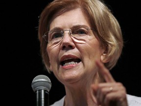 FILE - In this Wednesday, Aug. 8, 2018, file photo, U.S. Sen. Elizabeth Warren, D-Mass., speaks during a town hall-style gathering in Woburn, Ma. A DNA analysis done on Sen. Warren provides strong evidence she has Native American heritage. She provided her test results to The Boston Globe for a story published Monday.