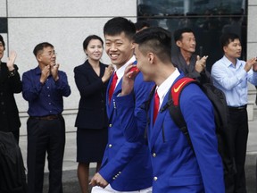 The Chinese sports delegation arrives at the airport Monday, Oct. 8, 2018, in Pyongyang, North Korea.